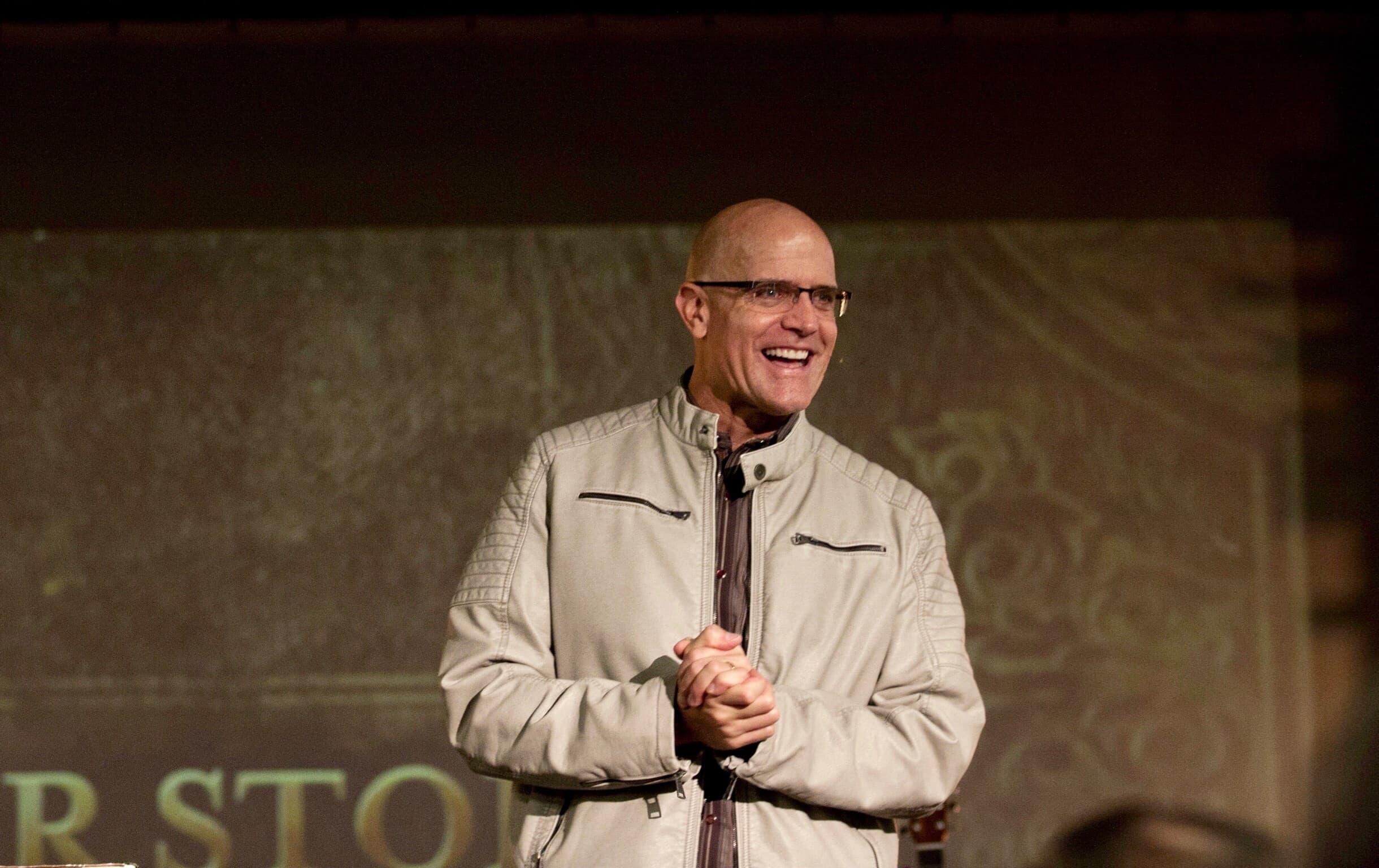 Marc Estes speaking on stage