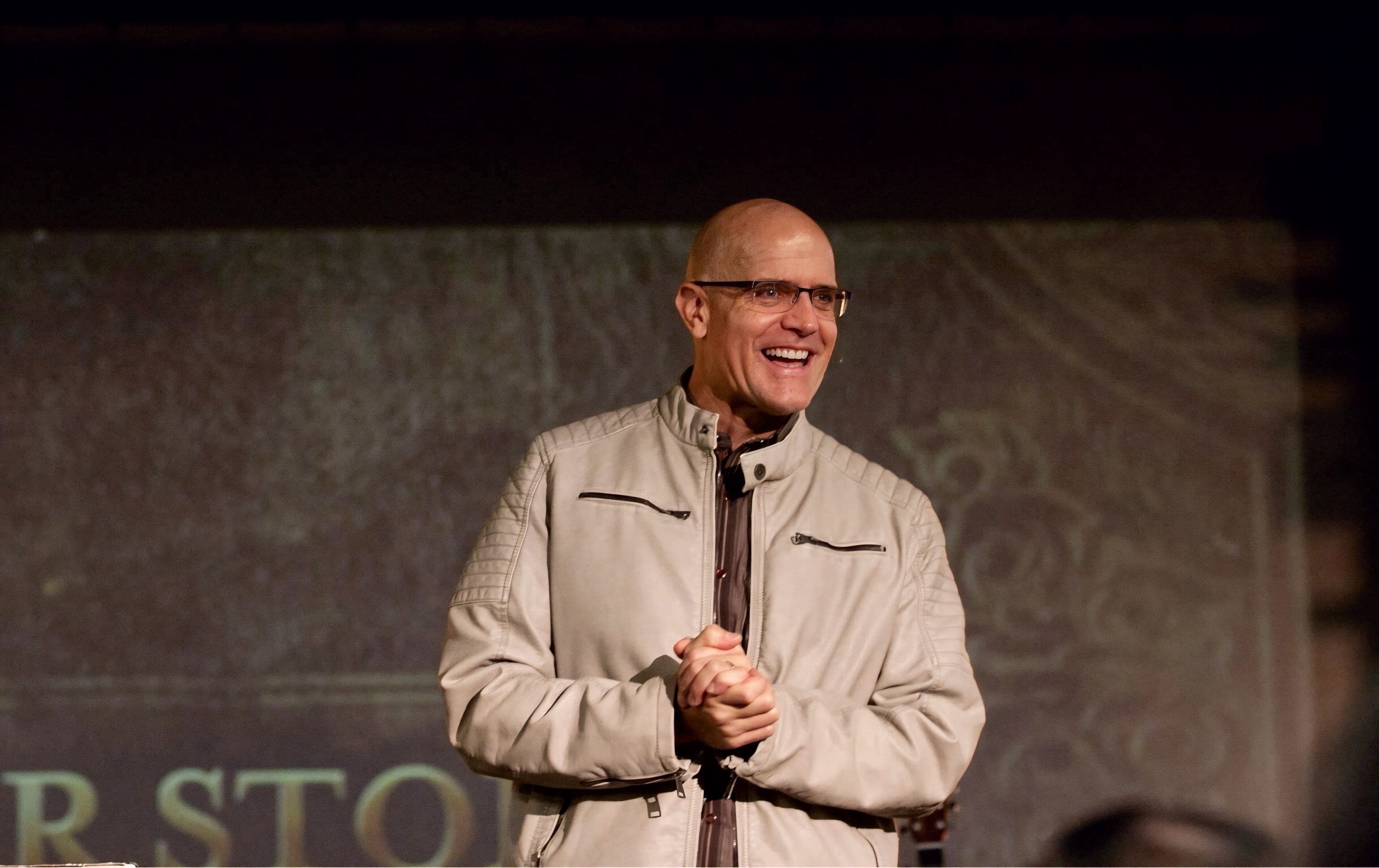 Marc Estes speaking on stage